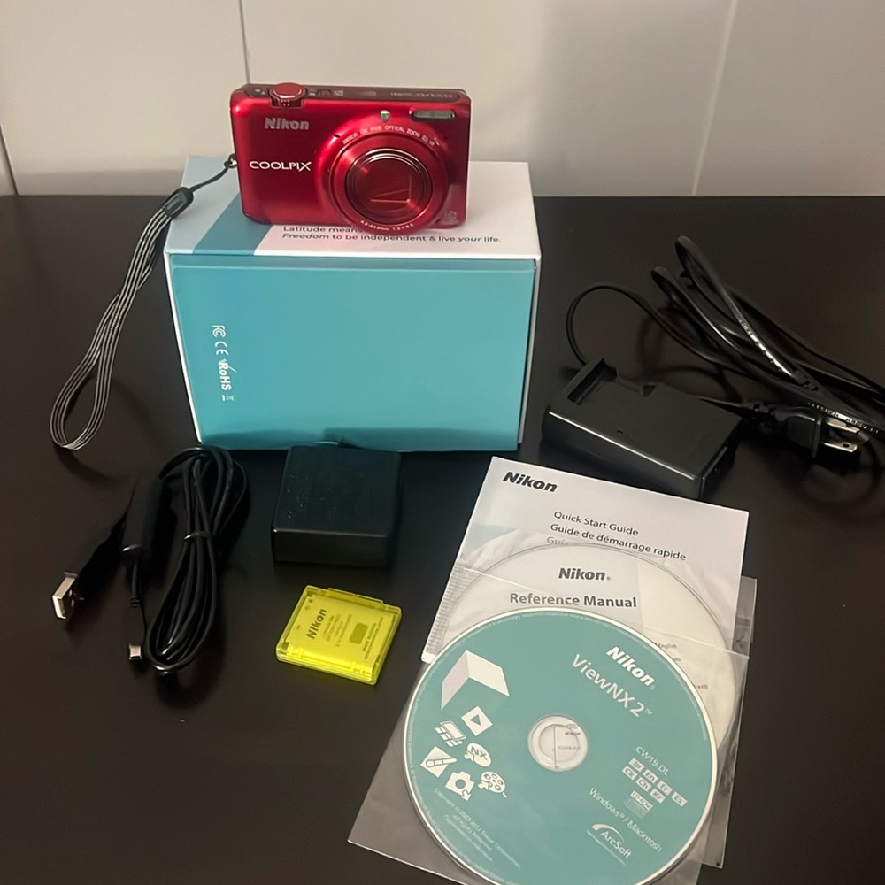 Red Nikon Coolpix S6500 with manual and chargers